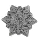Nordic Ware cast aluminum snowflake-shaped baking pan with intricate detailing, shown on a white background.