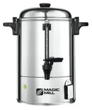 A polished, stainless steel hot water urn with a black spigot, a clear water level gauge, and a green indicator light. The urn has a "Magic Mill" logo on the front.