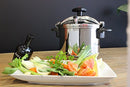 A medium-sized Magefesa Star 8.4-quart pressure cooker made of shiny 18/10 stainless steel, shown with a black safety handle and side handles.