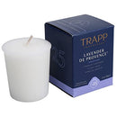 Trapp No. 25 Lavender de Provence 2 oz. votive candle in a simple white wax form, displayed next to its elegant navy and lavender packaging.