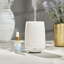 The Trapp No. 20 Water Diffuser Oil placed next to an ultrasonic diffuser, showcasing its intended use in a home setting.