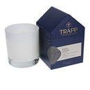 Trapp No. 77 Palo Santo 7 oz. House Box Candle in a frosted white glass container, placed next to its navy and gray house-shaped packaging.