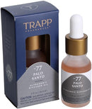 Trapp No. 77 Palo Santo 0.5 oz. Ultrasonic Diffuser Oil in a frosted glass bottle with a gold dropper cap, displayed next to its navy and gray packaging.