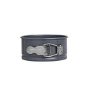 A small, round, metallic nonstick springform pan with a quick-release latch and a separate removable bottom.