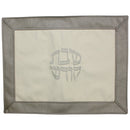 Elegant vinyl challah cover with ornate center and border design in 22 by 17 inch layout