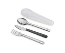 A stainless steel knife, fork, and spoon with black and silver handles, next to a translucent white rigid case. The handles are designed to fit together for compact storage.