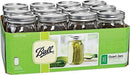 A green cardboard box containing a 12-pack of Ball brand clear glass wide mouth mason jars with silver lids.