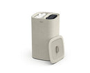 Joseph Joseph ecru dual-compartment laundry hamper with two removable fabric bags and a lid, displayed on a white background.