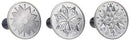Nordic Ware set of three silver cast aluminum cookie stamps with midnight blue wooden handles, each with starry round designs, shown on a white background.