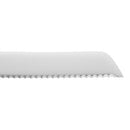 Close up of serrated stainless steel blade, shown on a white background.