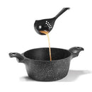 A versatile black nylon ladle by Starfrit, featuring a built-in skimmer function for easy separation of solids from liquids.