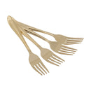 Set of four gold dessert forks with hammered handles, displayed on a white background.