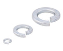 Three silver-colored split lock washers in different sizes.