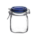 A clear, empty Bormioli Rocco Fido square glass jar with a dark blue hinged lid and wire bail closure, featuring an airtight rubber gasket.