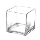 A clear, square-shaped glass cube vase with a slightly curved base.
