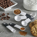 White plastic measuring spoon set with black accents and organizing ring