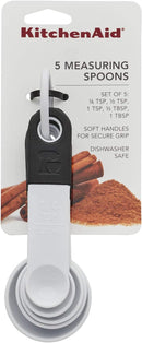 White plastic measuring spoon set with black accents and organizing ring