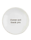 A round, white ceramic tapas plate available in various styles, featuring a unique rim texture (beaded or pleated) and a humorous black phrase.