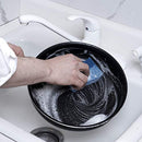 A stacked pile of three rectangular, dual-sided cleaning sponges. Each sponge has a light blue absorbent cellulose side and a dark blue non-scratch scouring pad side.