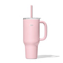 A tall, matte pink OXO Strive XL tumbler with a clear lid, a pink straw inserted, and a sturdy pink handle on the side. The gray OXO logo is visible on the tumbler's body.
