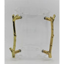 A clear acrylic washing cup with two gold-colored, textured handles designed to resemble tree branches.