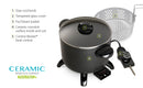 A black electric multi-cooker with a nonstick interior, short legs, a glass lid, and a detachable black temperature control probe.