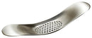 A sleek, stainless steel garlic press with a unique curved shape and perforated crushing surface.