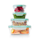 The OXO Good Grips Smart Seal 12-Piece Glass Container Set is displayed with two stacks of containers. One stack shows two round glass containers with teal lids nested. The other stack shows four rectangular glass containers with teal lids, increasing in size from top to bottom.