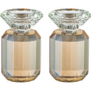 Pair of gold-colored faceted crystal candlesticks with clear tops.