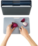 Small Folio plastic cutting board set with four color-coded boards in a slimline case, displayed on a white background.