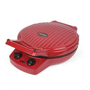 Red electric pizza maker with a cooked pizza inside, lid open, and controls visible.