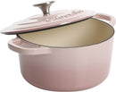 Blush pink cast iron Dutch oven with lid.