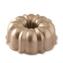 Nordic Ware toffee-colored classic Bundt pan with fluted edges and a center tube on a white background.