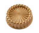 Nordic Ware Charlotte Cake Pan in toffee color with a fluted, ring-shaped design, displayed on a white background.