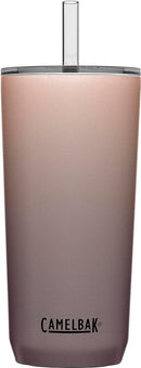 A stainless steel travel tumbler with a rose gold and gray ombre finish, a clear lid, and a clear reusable straw. The CamelBak logo is visible at the bottom.