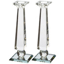 Pair of clear faceted crystal candlesticks with square bases.
