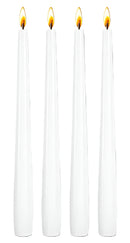 Four tall white tapered candles standing upright on a white background, ideal for Passover seder use.