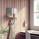 A sleek white wall-mounted organizer mirror with rounded corners, featuring a light wood shelf beneath it. Below the shelf, a white bar extends with several wooden peg hooks.