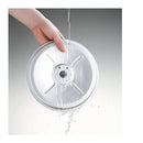 A white Zojirushi rice cooker, featuring multiple cooking functions and an automatic keep-warm cycle for convenient meal preparation.