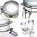An empty, clear glass Fido jar with a glass lid and a metal wire clamp closure for an airtight seal.