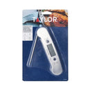 Taylor digital meat thermometer with folding stainless-steel probe and digital display, shown in it's orignal packaging, on a white background.