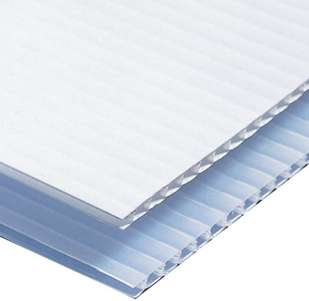 Close-up of two sheets of corrugated plastic, one translucent blue and the other opaque white, showcasing their textured surfaces.