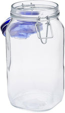 A clear glass Bormioli Rocco Fido jar with a dark blue hinged lid and wire bail closure.