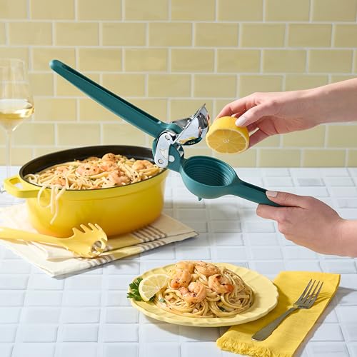 A side view of a teal-colored Chef'n FreshForce Lemon Squeezer, showcasing its ergonomic design with two long handles, and visible chrome-plated metal components at the hinge and pressing mechanism.