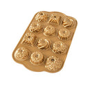 Nordic Ware Bundt Charms gold mini cake pan with 12 small Bundt cavities on a white background.