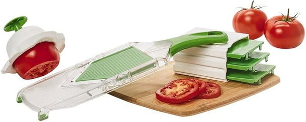 Green handheld Farberware mandoline slicer with stainless steel blade on a white background.