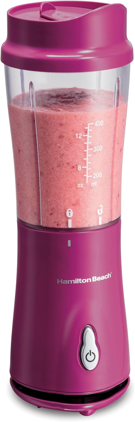 Pink Hamilton Beach portable blender with 14 oz BPA-free travel cup and stainless steel blades displayed on a white background.