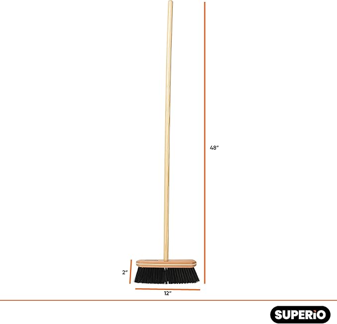 Superio kitchen broom with black tampico bristles and wooden handle on a white background.