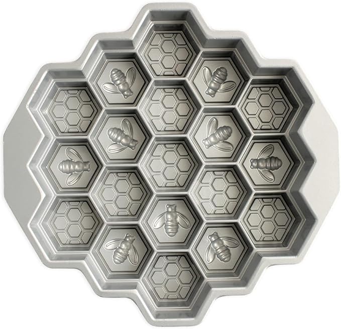 Nordic Ware toffee-colored honeycomb pull-apart Bundt pan with hexagonal cake molds on a white background.
