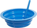 A colorful collapsible silicone bowl in blue with straws